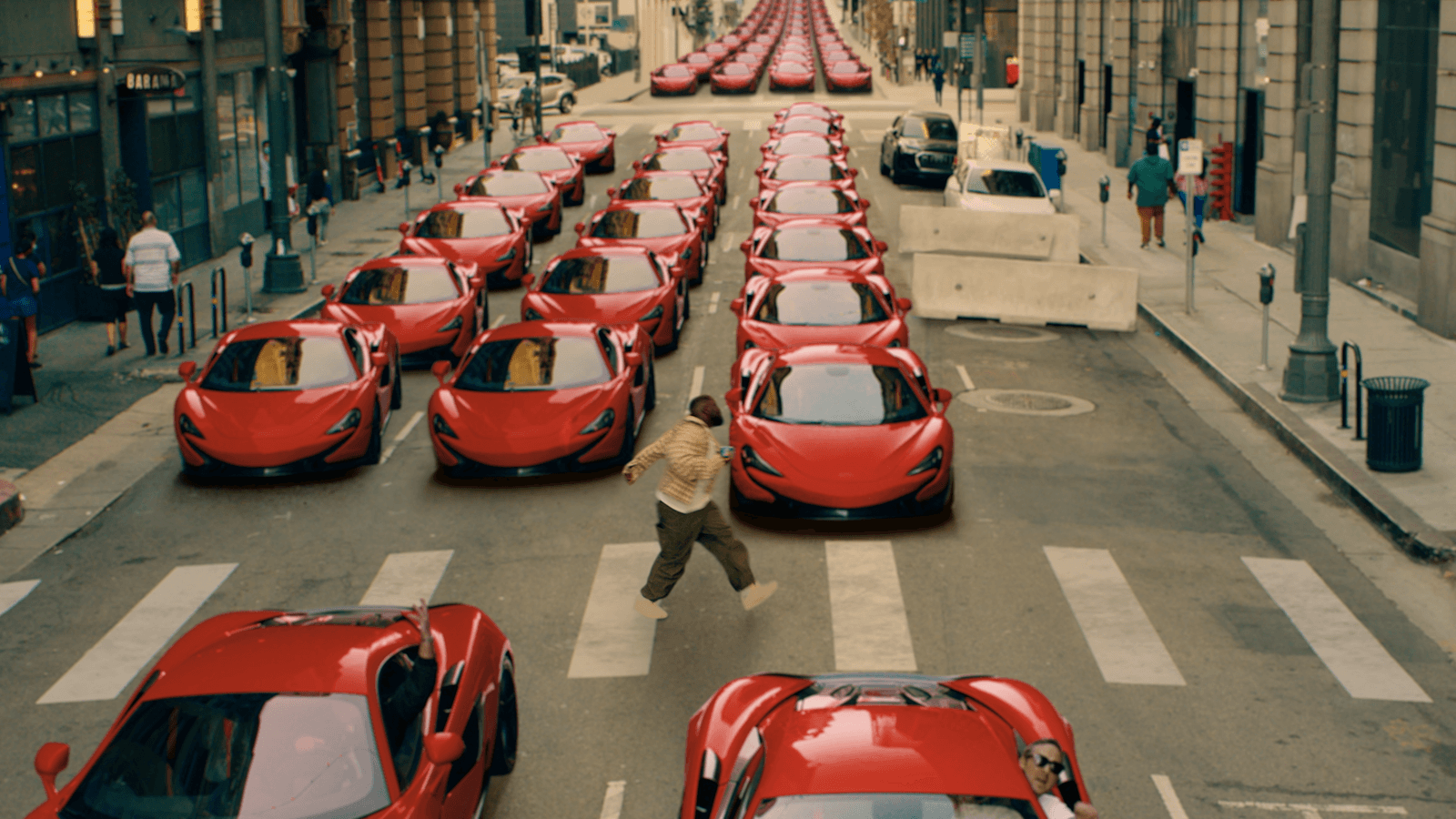 Rows of identical red cars fill a city street.
