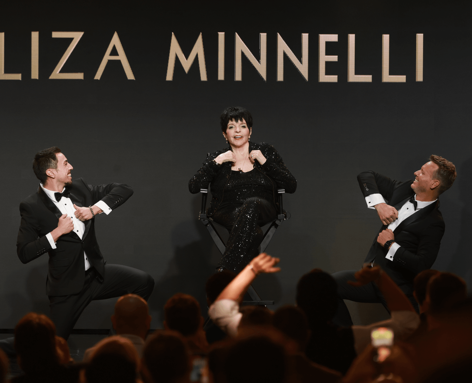 Presenters and a guest on stage beneath the name Liza Minnelli at the 2026 GLAAD Media Awards.