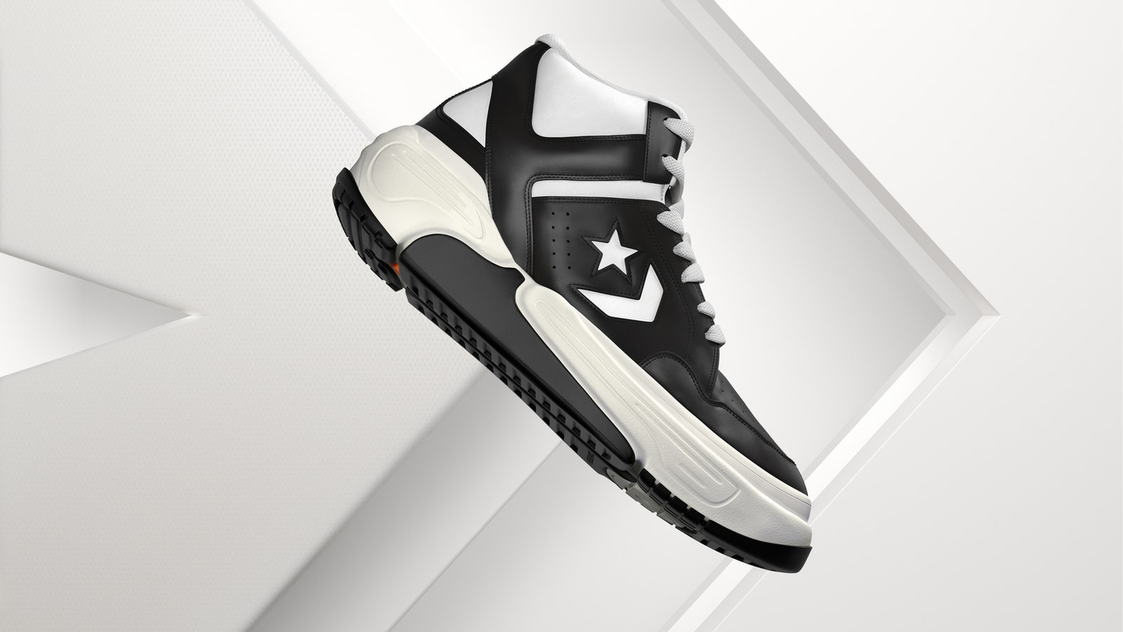 Black and white Converse Weapon CX sneaker against sculpted white forms.