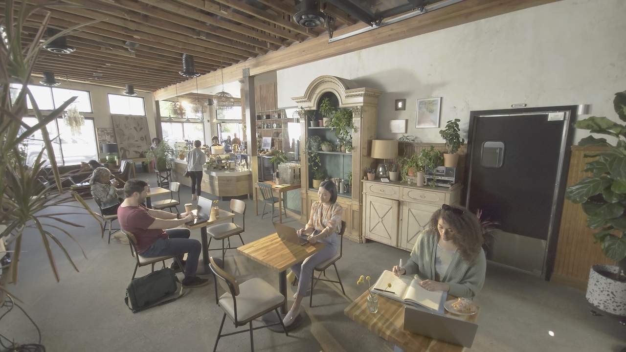 A wide café shot before visual effects.